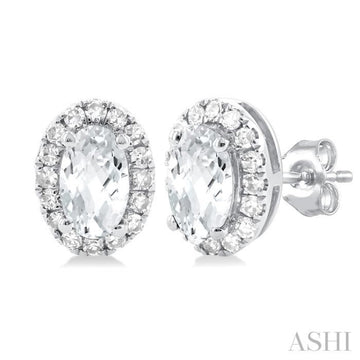 5x3 MM Oval Shape White Topaz and 1/8 Ctw Single Cut Diamond Halo Semi-Precious Stud Earrings in 14K White Gold
